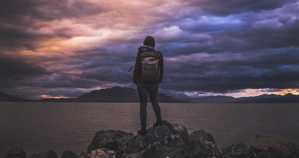 Hiker looking out over a mountain landscape
