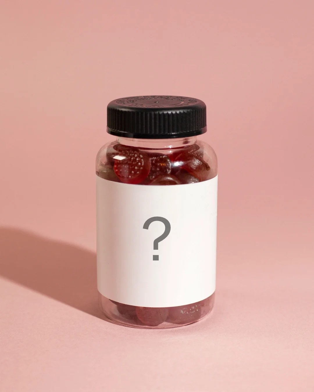 A supplement bottle with a blank label and a question mark